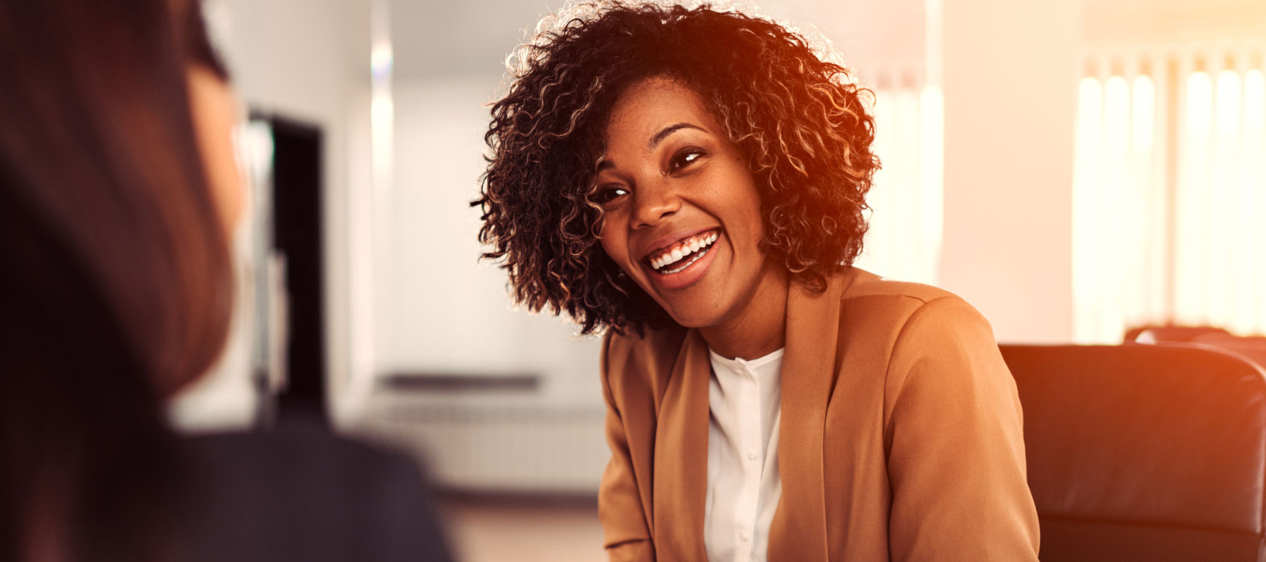 A lady smiles at the camera.