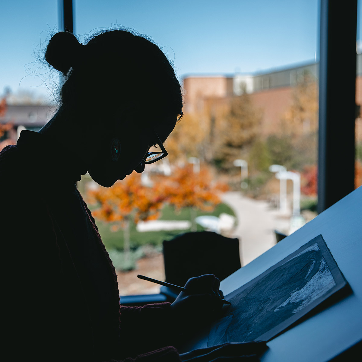 Adult learner in a continuing education art program, which is part of Normandale's course catalog.