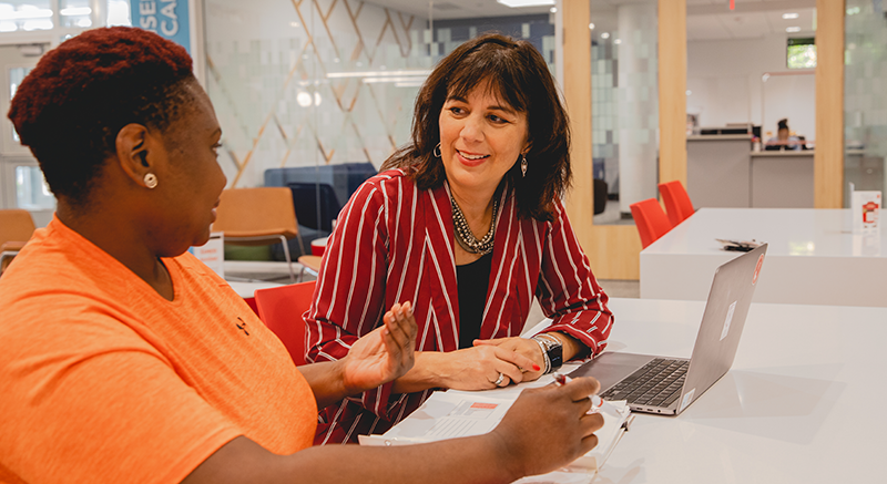 Image of one of Normandale's non-traditional students meeting with an advisor