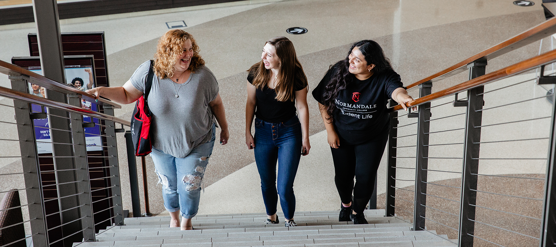 Students walking the halls at Normandale, one of the MN community colleges with no application fee.