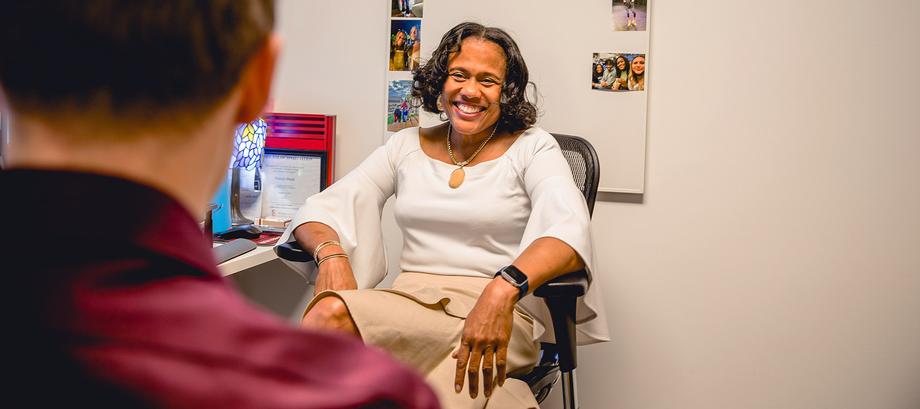 Counselor Frances with a student.