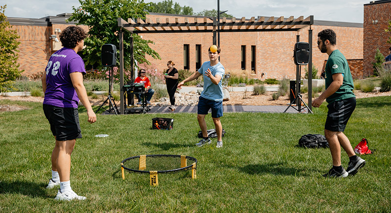 Students play Spikeball.