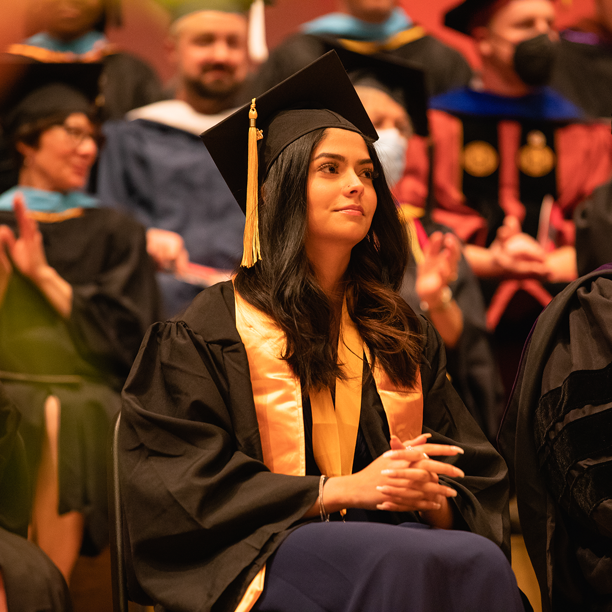 Normandale students in cap and gown at graduation