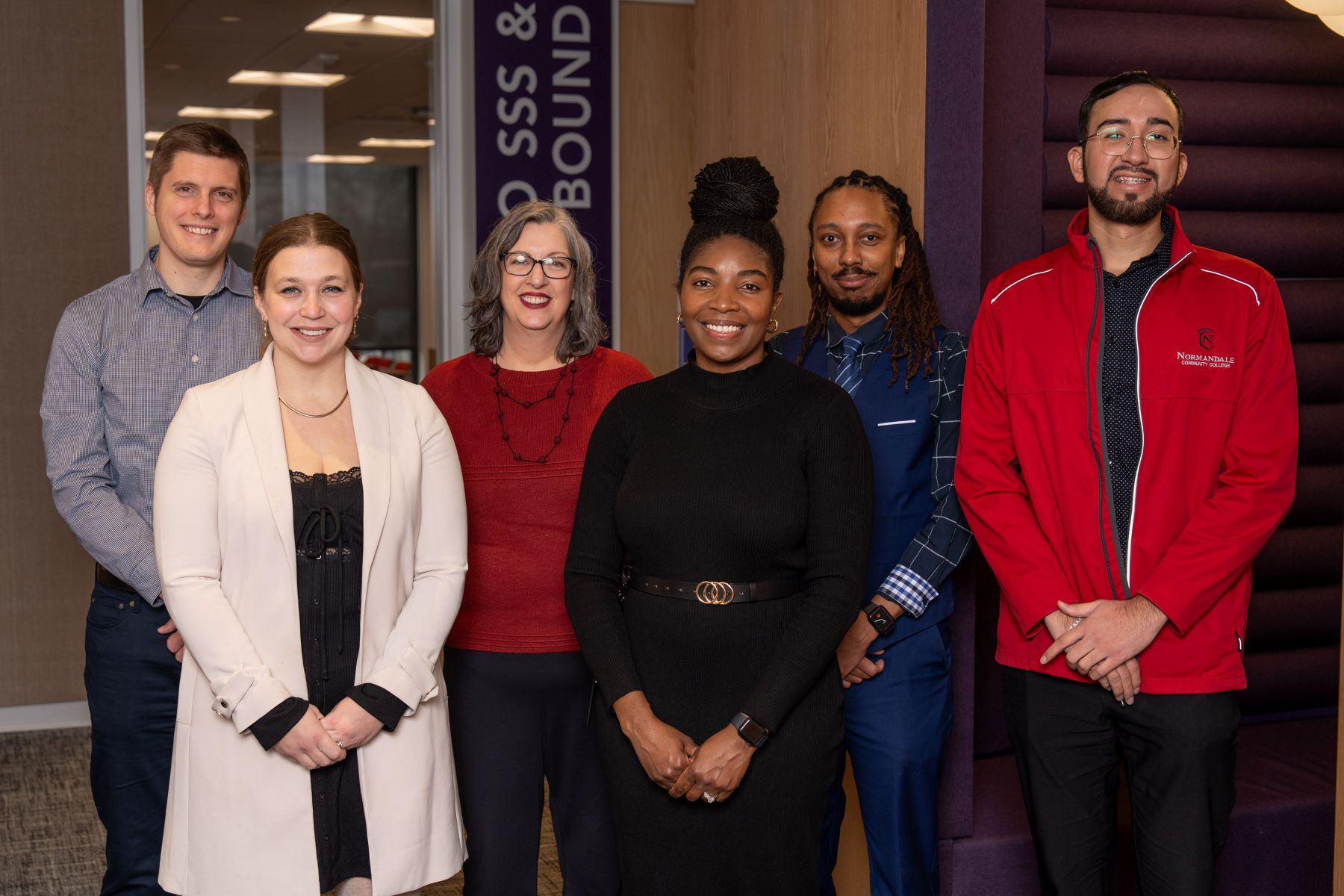 Group photo of six TRIO SSS staff members in front of the TRIO office