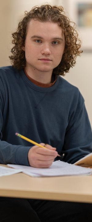 A Normandale student smiles at the camera