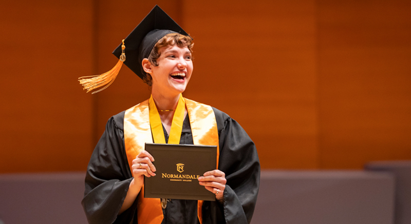 A Normandale student at commencement ceremony.